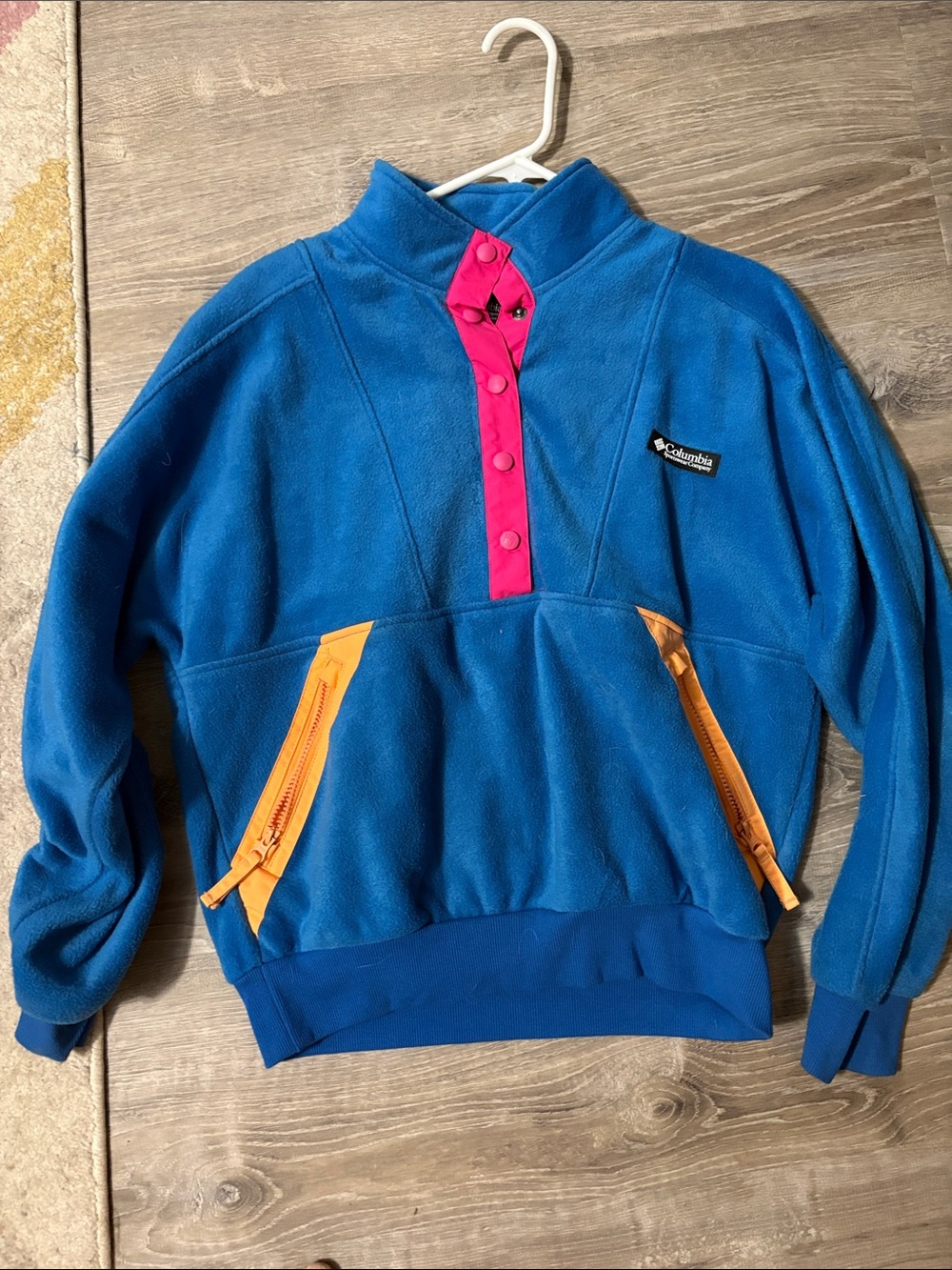 Columbia Blue Fleece Pullover with Pink Snap Placket and Orange Zip Pockets